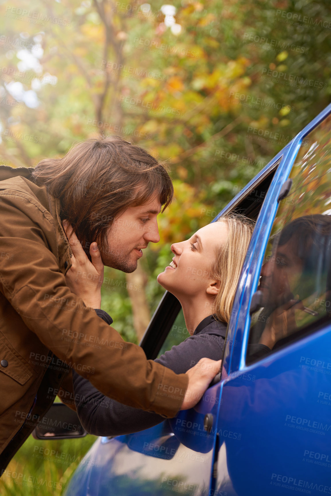 Buy stock photo Travel, window and couple kiss in car for greeting, goodbye and love on journey, leaving and commute. Transport, driving and man and woman in vehicle for bonding, relationship or embrace on road trip