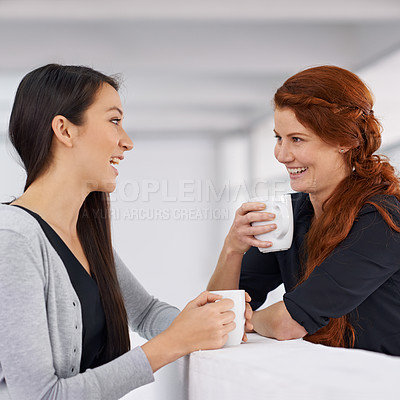 Buy stock photo Business women, coffee and conversation with laughing for gossip, funny story or partner in office. Work friends, happy and listen with drink, latte and chat to start morning in corporate workplace