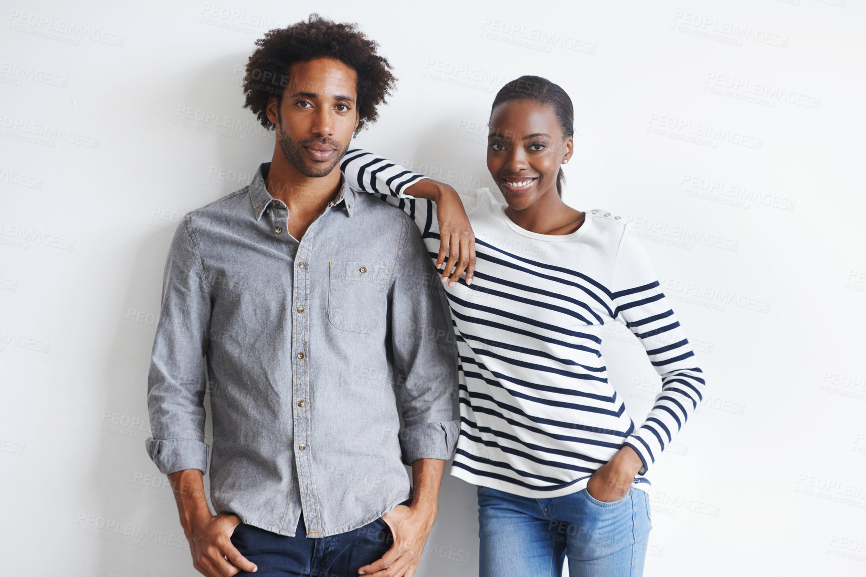 Buy stock photo Couple, happy and portrait by white wall in fashion with confidence, casual style and model aesthetic. Black woman, and face of man with trendy apparel, edgy clothes and smile with bonding and relax