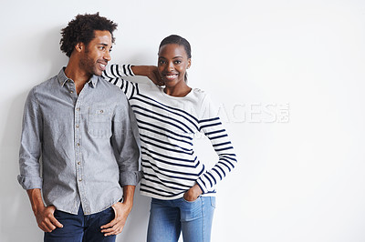 Buy stock photo Couple, smile and portrait by white wall in fashion with confidence, casual style and model aesthetic. Black woman, and face of man with trendy apparel, edgy clothes and pride with support and relax