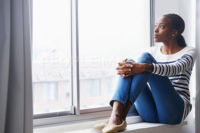 Buy stock photo Woman, relax and thinking by window in new home with confidence for real estate investment and mortgage. African homeowner, person and thoughtful with future house ideas and relocation in living room