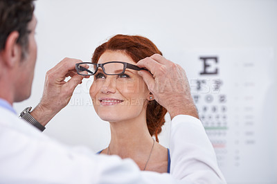Buy stock photo Man, optician and patient with glasses for eye exam consultation or healthy vision, retina or testing. Male person, woman and eyewear conversation for wellness checkup or advice, prescription or care