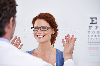 Buy stock photo Man, optician and patient with glasses for eye test consultation for vision, retina or examination. Male person, woman and eyewear conversation for wellness checkup or advice, prescription or care
