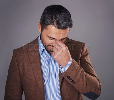 Buy stock photo Business man, eye strain and stress in studio, burnout and suffering from headache or pain. Male person, migraine and gray background for mental health, frustration and overwhelmed by pressure of job