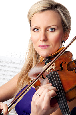 Buy stock photo Studio shot of a beautiful young woman playing the violin