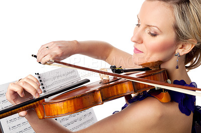 Buy stock photo Studio shot of a beautiful young woman playing the violin