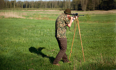 Buy stock photo Hunter, gun and man in field in nature on a Africa safari for animal shooting with a weapon on vacation. Hunting sport, male person and target hunt practice of a traveler in camouflage with a scope