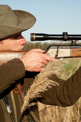 Buy stock photo Hunting, gun and man on a Africa safari in field for shooting animals on wildlife holiday. Weapon, sniper and male person aim for wild game in nature with hunt and scope for target shot in the sun