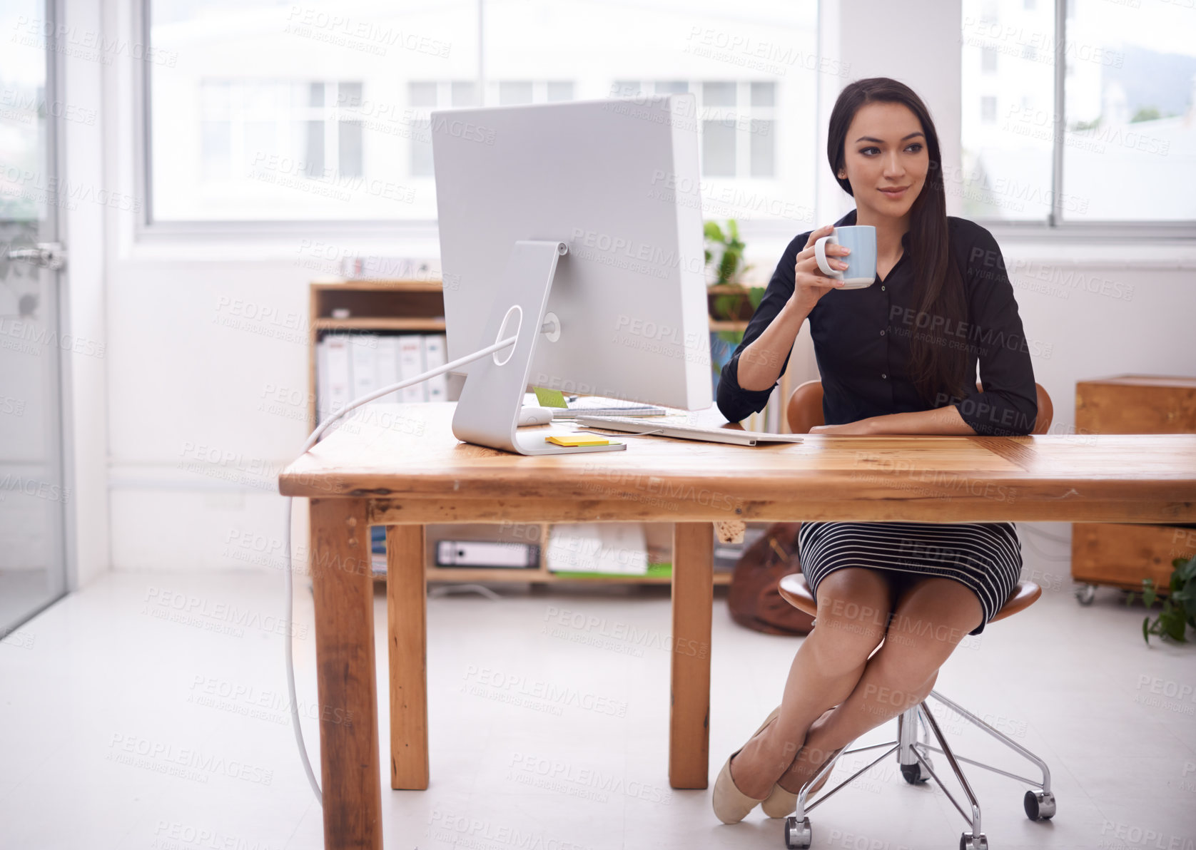 Buy stock photo Shot of a young businesswoman in her office