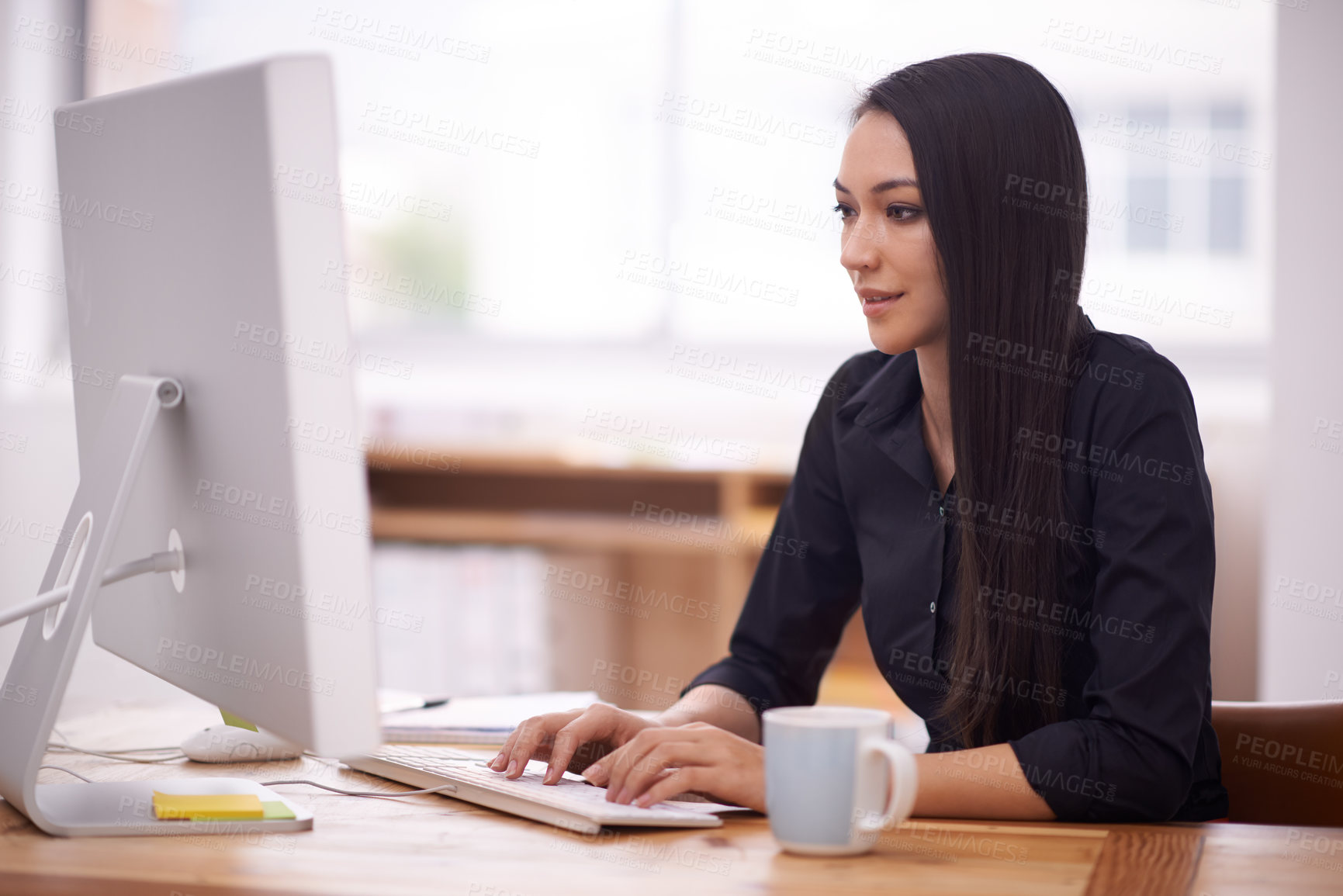 Buy stock photo Shot of a young businesswoman in her office