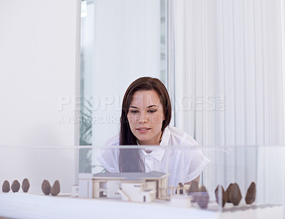 Buy stock photo Woman, architect and 3D model with prototype for architectural, real estate or industrial design at office. Female person, contractor or civil engineer looking at building structure or construction