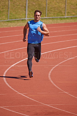 Buy stock photo Man, athlete and run on race track for sports, fitness and cardio with speed and action outdoor. Exercise, workout and training at stadium or arena, moving for health with fast runner or sprinter