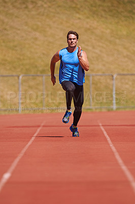 Buy stock photo Man, athlete and run on race track with speed, fitness and cardio for sports and action outdoor. Exercise, workout and training at stadium or arena, moving for health with fast runner or sprinter