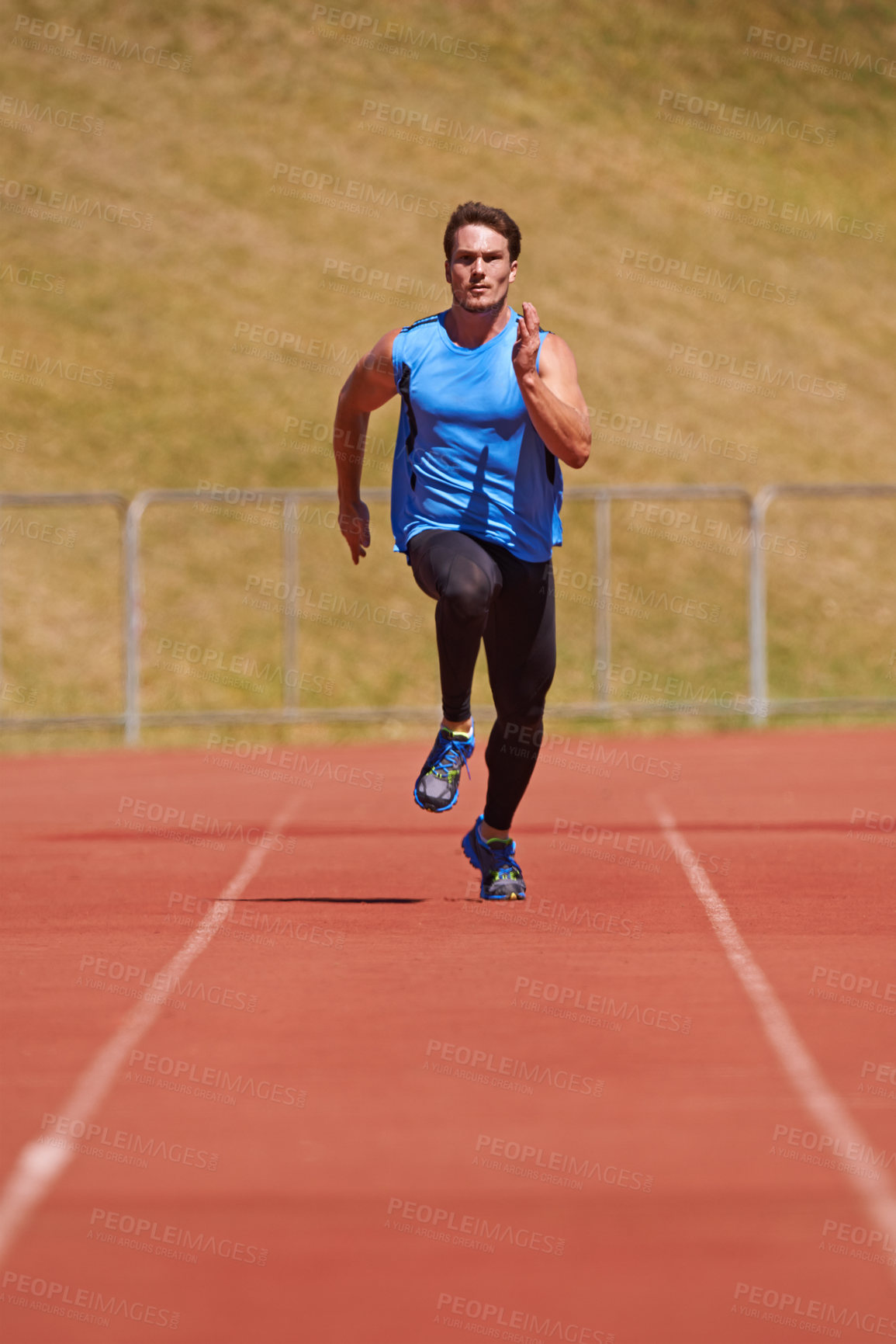 Buy stock photo Man, athlete and run on race track with speed, fitness and cardio for sports and action outdoor. Exercise, workout and training at stadium or arena, moving for health with fast runner or sprinter