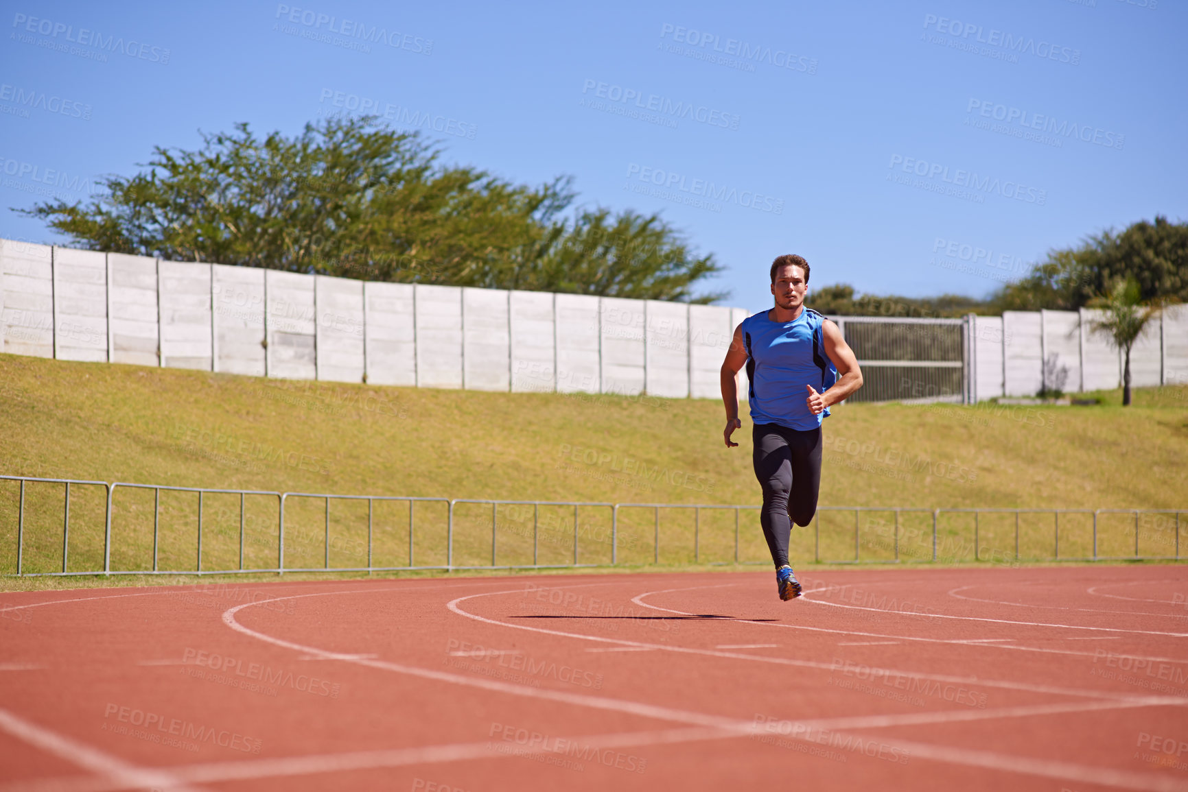 Buy stock photo Man, sports and run on race track with speed, fitness and cardio with athlete and action outdoor. Exercise, workout and training at stadium or arena, moving for health with fast runner or sprinter