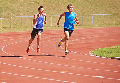 Buy stock photo Race track, running and fitness men outdoor for marathon, training or intense morning cardio. Exercise, action and runners at sports stadium for athletic contest, speed or performance challenge