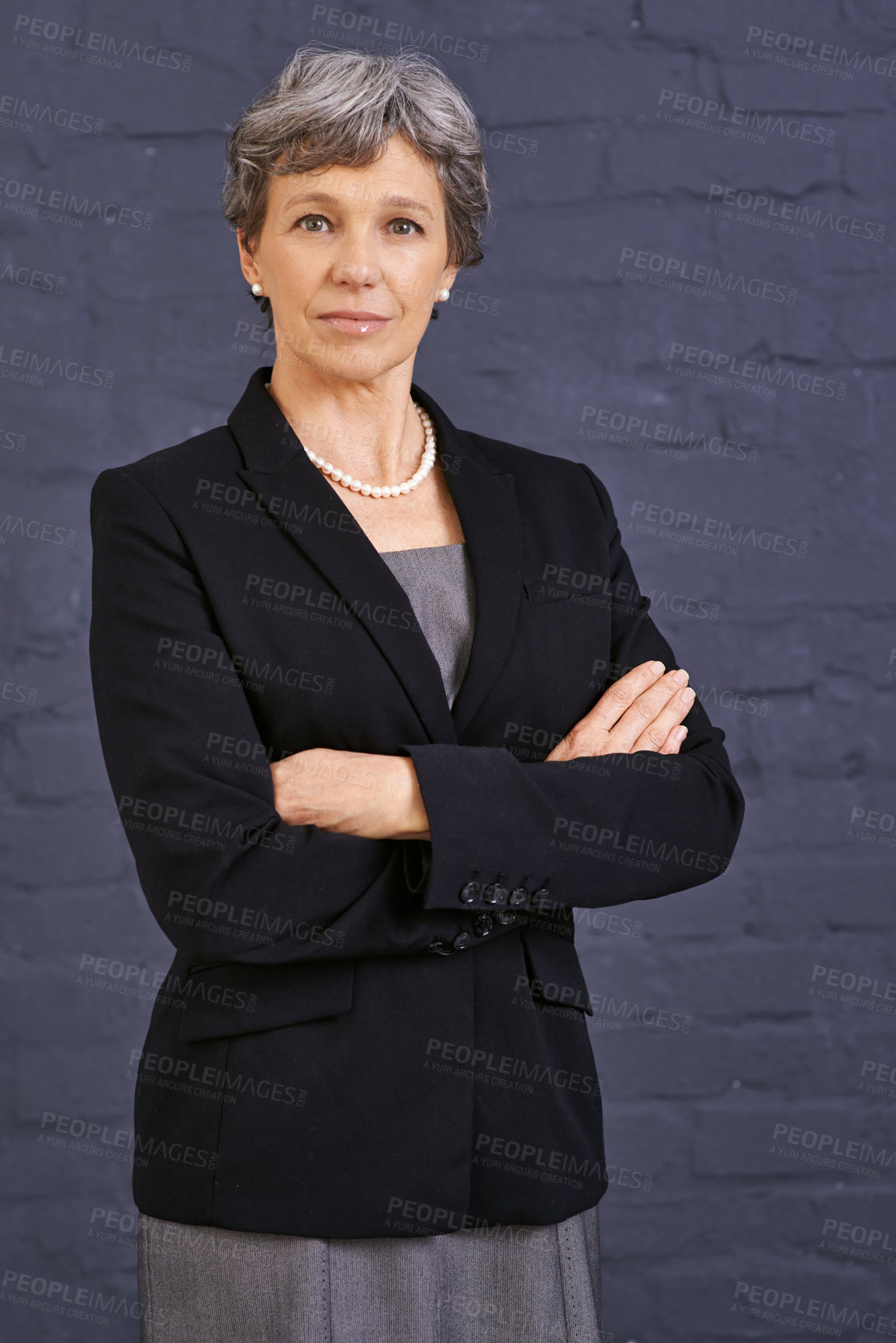 Buy stock photo Mature woman, arms crossed and corporate professional with serious face, pride and ambition on wall background. Management, confidence in portrait and real estate agent in London with business