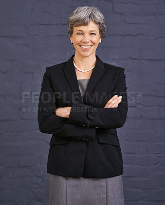 Buy stock photo Portrait of a happy senior businesswoman smiling at the camera