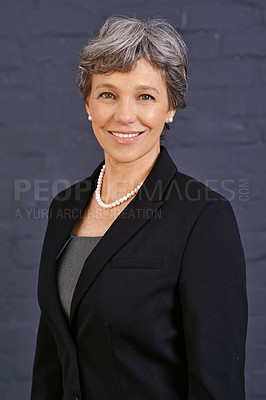 Buy stock photo Senior woman, portrait and corporate professional with smile, pride and ambition on wall background. Management, confidence and real estate agent in London with empowerment and happy in career
