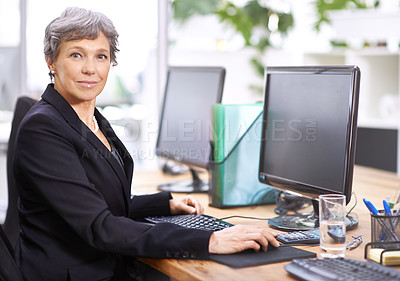 Buy stock photo Business woman, portrait and senior professional office manager at a computer with a smile for digital work. Tech, desk and happy executive with online job and confidence from company admin career