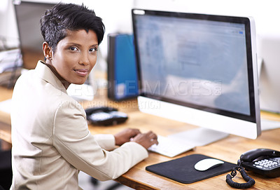 Buy stock photo Portrait of an attractive businesswoman working on a desktop computer