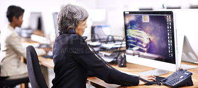 Buy stock photo Cropped shot of two businesswomen working in an office
