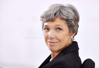 Buy stock photo Portrait of a mature businesswoman sitting indoors