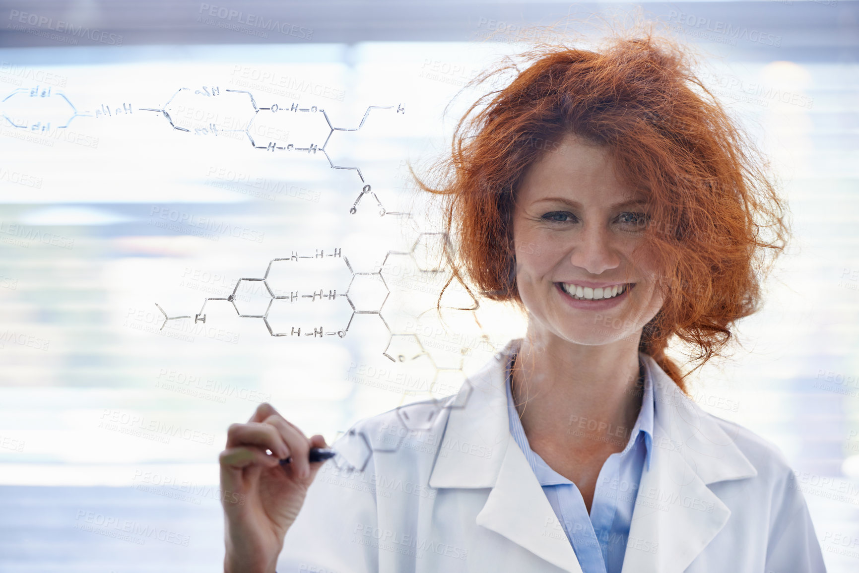 Buy stock photo A messy-haired female scientist standing in her lab proudly