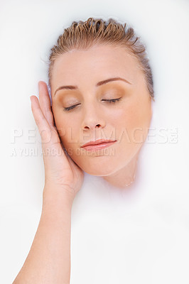 Buy stock photo A beautiful woman indulging in a milky bath