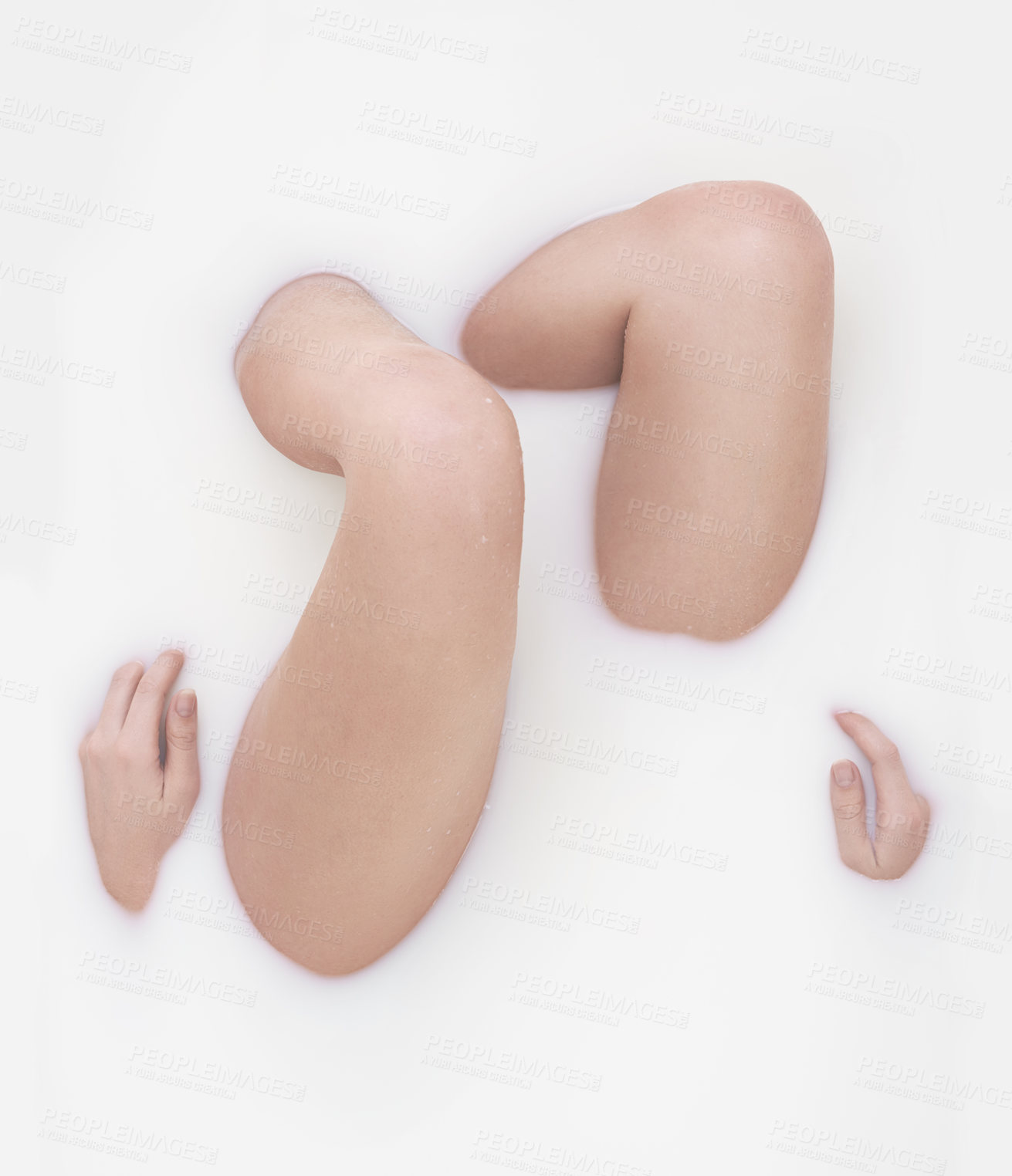 Buy stock photo Cropped shot of a woman's legs in a milky bath