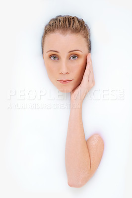 Buy stock photo Woman, portrait and milk or bath for cosmetics, beauty and moisturize on white background. Female person, luxury spa treatment and pamper for smooth skin, dermatology and grooming for hydration