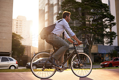 Buy stock photo Morning, bicycle and business man in city for moving, commute and carbon neutral transportation. Travel, sustainability and cycling with male employee in urban town for journey, energy and transit