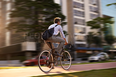 Buy stock photo Fast, bicycle and business man in city for morning, commute and carbon neutral transportation. Travel, sustainability and cycling with male employee in urban town for motion blur, speed and transit
