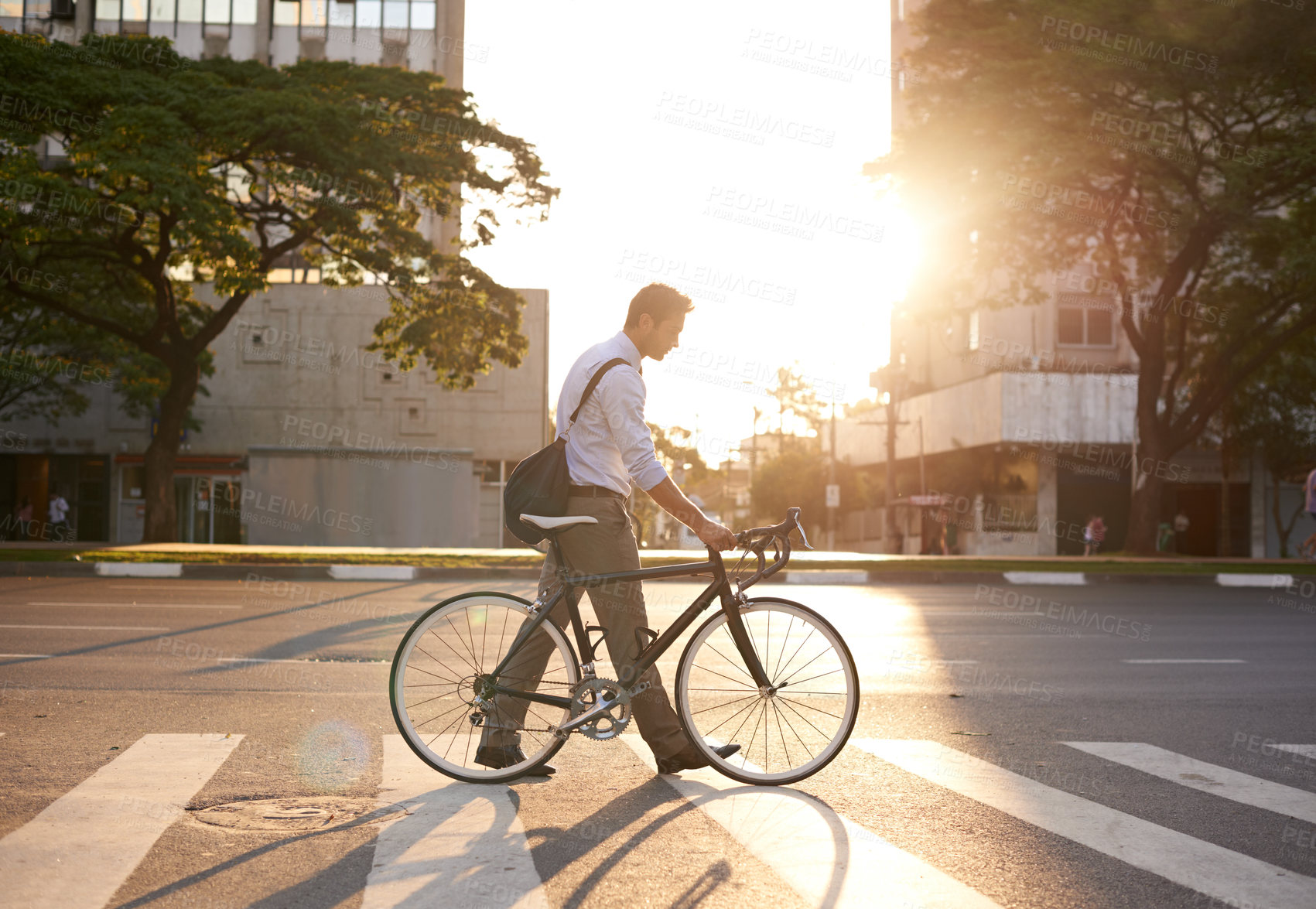 Buy stock photo Commute, bike and business man in city for morning, travel and carbon footprint. Cycling, transportation and urban with male employee walking on crosswalk for journey, transit and professional