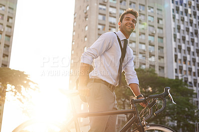 Buy stock photo Cycling, morning and business man in city for commute, carbon neutral and transportation. Sustainable, professional and travel with male employee walking with bike in urban town for journey and trip