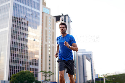 Buy stock photo Sports, exercise and man running in the city for health, wellness or training for a marathon. Fitness, runner and male athlete doing an outdoor cardio workout for endurance or speed in an urban town.