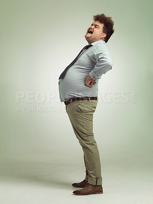 Buy stock photo Business man, portrait and plus size with laughing, funny and silly in a studio with arms on hips. Goofy, employee and office fashion with comedy and fun joke with green background and humor