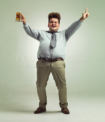 Buy stock photo Happy man, portrait and celebration with beer for party or obesity on a studio background. Young male person or plus size model with glass, mug or alcohol in satisfaction for booze on mockup space