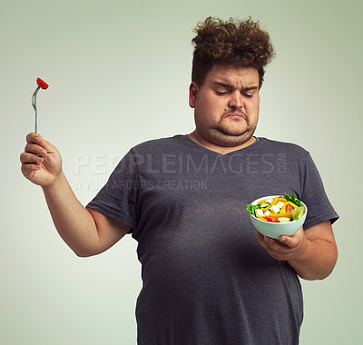 Buy stock photo Studio, unhappy man and salad with bowl for healthy meal, diet and nutrition for weight loss. Plus size, male person and disgust expression with organic food for wellness, detox or lifestyle change