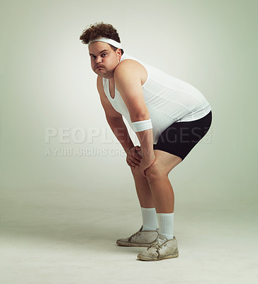 Buy stock photo Shot of an plus size man crouching after a workout