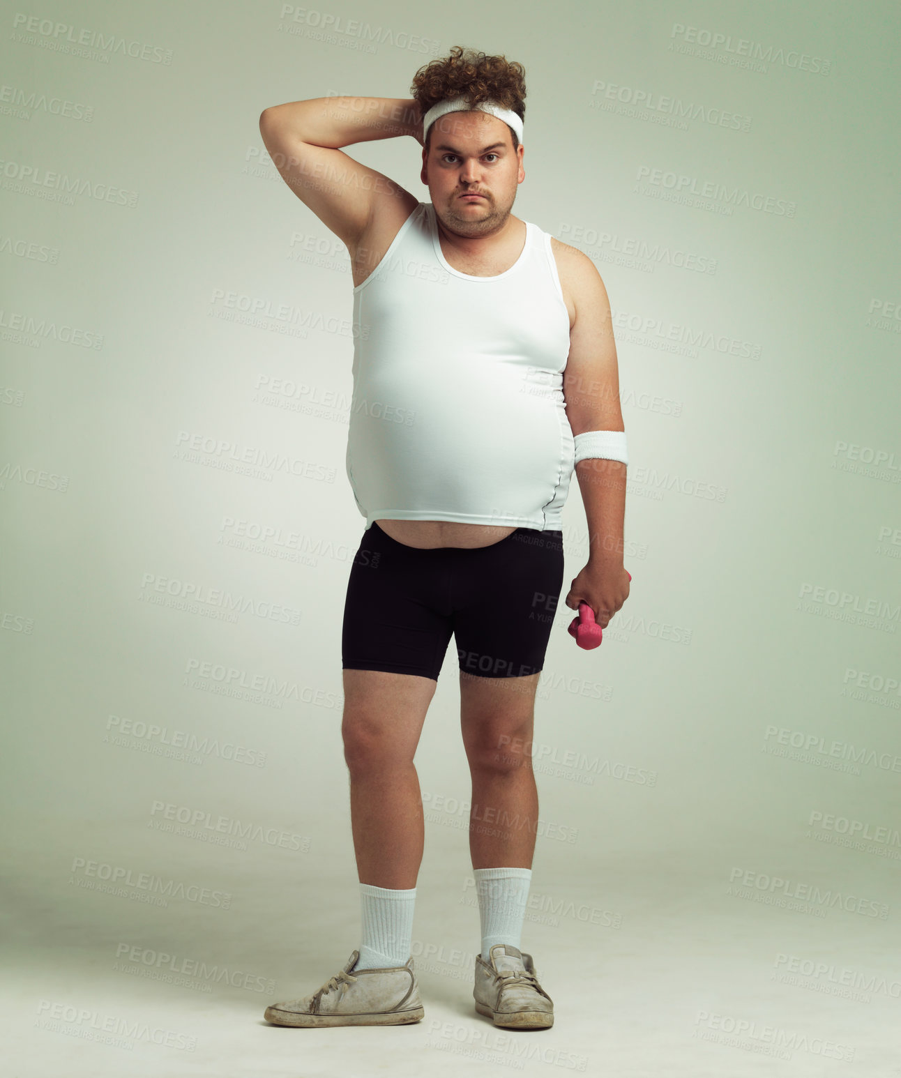 Buy stock photo Man, portrait and dumbbell in studio for workout, plus size and exercise for weight loss on background. Male person, training and gym equipment for health, challenge and body development for fitness