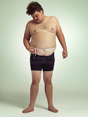 Buy stock photo Man, plus size and stomach with measurement in studio on white background with tape for progress, weight loss and exercise. Positivity, fitness and body with self care to monitor health and shape