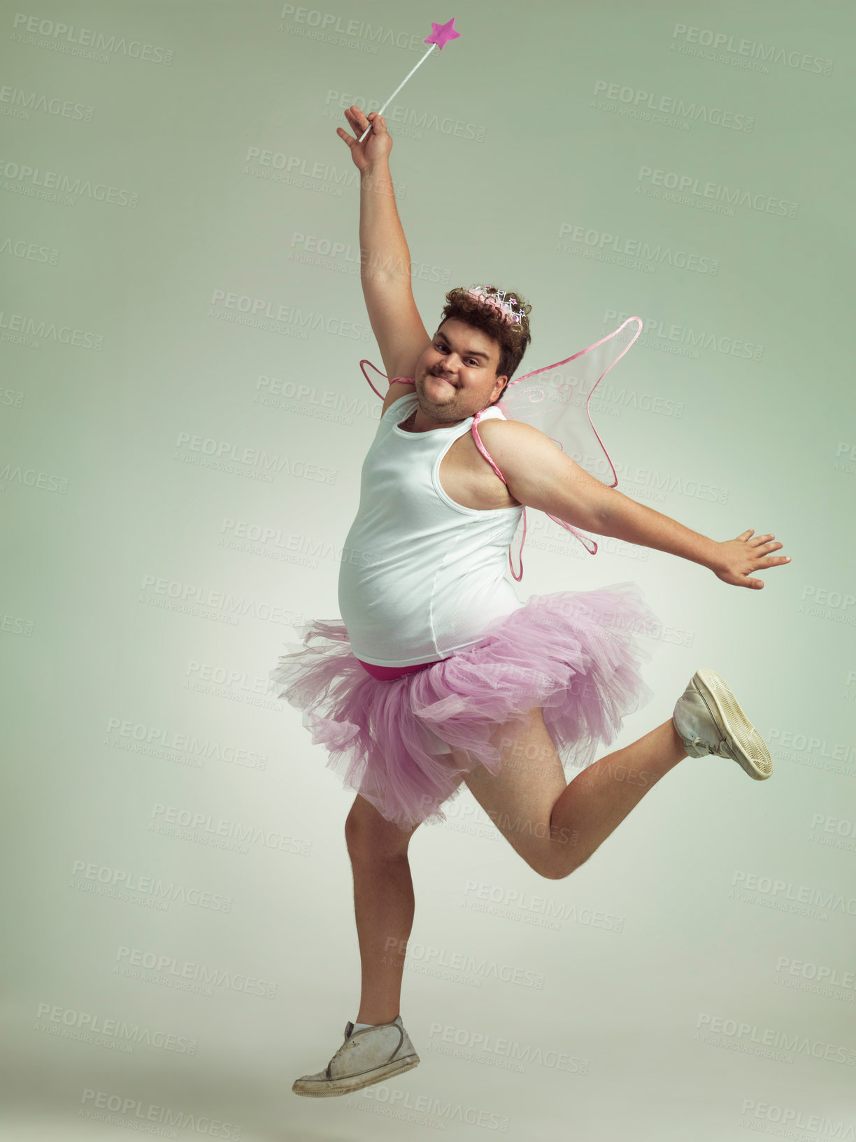 Buy stock photo An overweight man comically dressed-up in a pink fairy costume