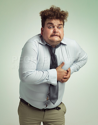 Buy stock photo Frustrated man, plus size and heart attack with cardiac arrest or ache on a studio background. Male person or model with pain, body fat or cholesterol in obesity, unhealthy or overweight on mockup