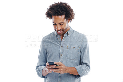 Buy stock photo Studio shot of a handsome man using his mobile phone isolated on white