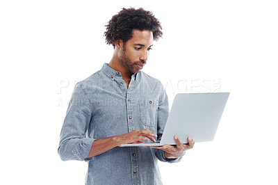 Buy stock photo Studio shot of a handsome man holding a laptop isolated on white