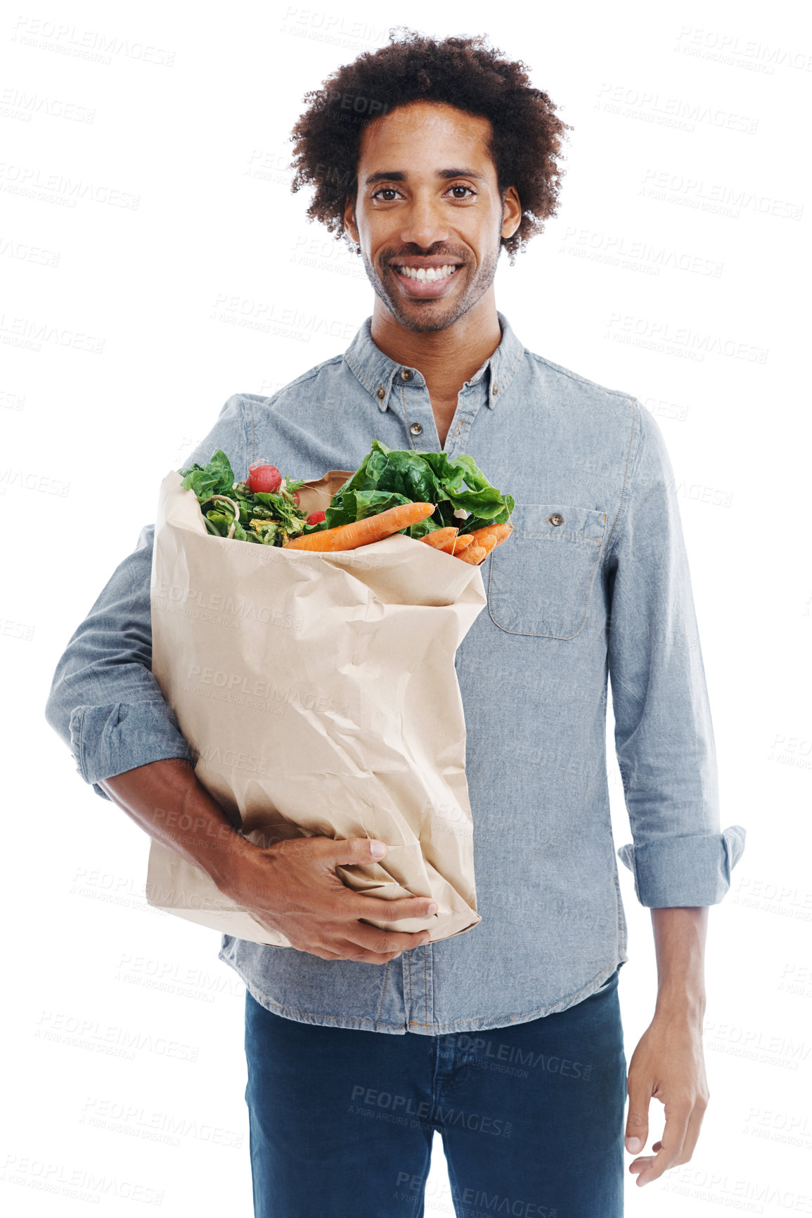 Buy stock photo A handsome young black man holding groceries