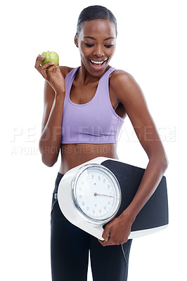 Buy stock photo Fitness, apple and scale with happy black woman in studio isolated on white background for weight loss. Exercise, smile and diet with confident young sports model training for health or nutrition