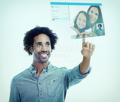 Buy stock photo A handsome young black man using a transparent touchscreen.All screen content is designed by us and not copyrighted by others, and upon purchase a user license is granted to the purchaser. A property release can be obtained if needed.