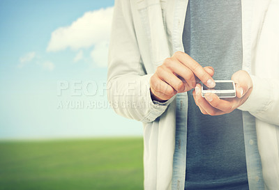 Buy stock photo Hands, phone and space with a person in the countryside on a nature or blue sky background for communication. Social media, environment and an adult outdoor on a green field for networking closeup